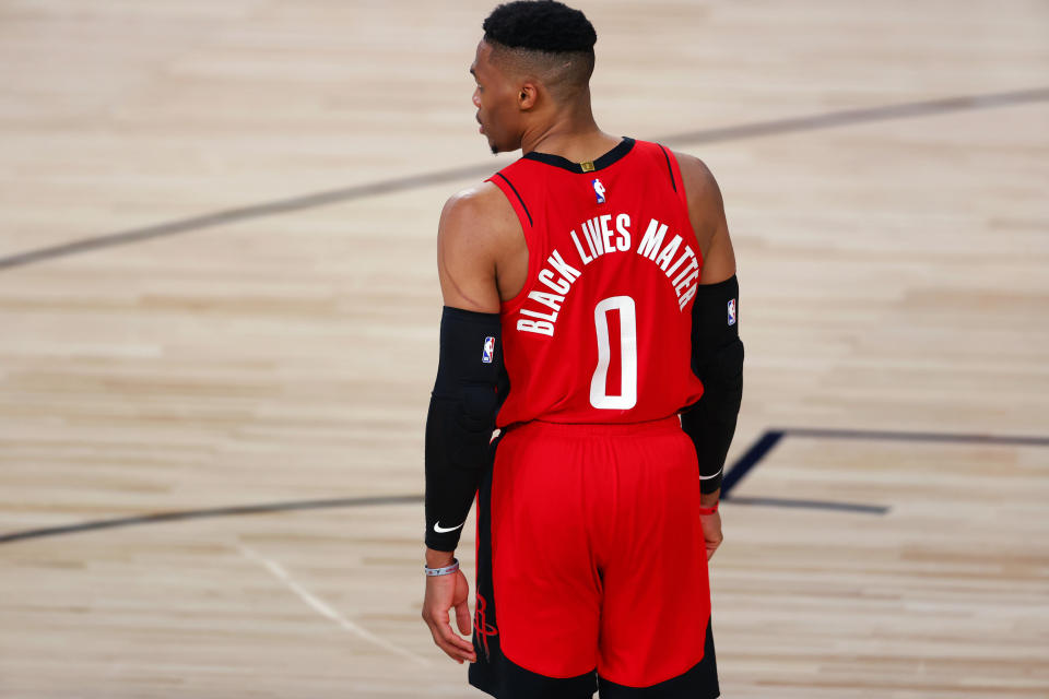 Houston Rockets' Russell Westbrook wears "Black Lives Matter" on the back of his jersey during the team's NBA basketball game against the Milwaukee Bucks on Sunday, Aug. 2, 2020, in Lake Buena Vista, Fla. (Mike Ehrmann/Pool Photo via AP)