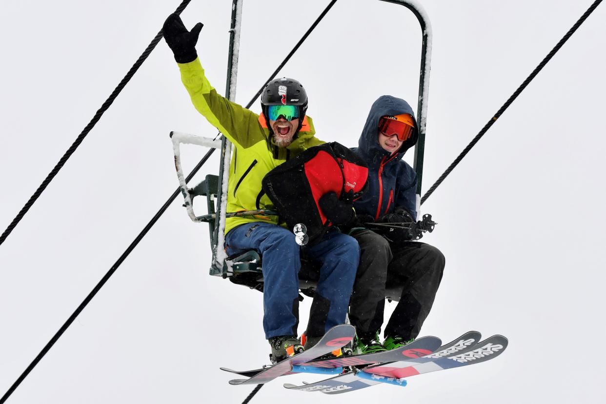 An enthusiastic skier rides a lift at Smugglers' Notch Resort in Jeffersonville.