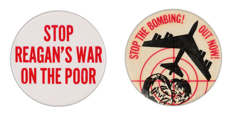 Two campaign buttons: one reads "stop Reagan's poor on the war," the other shows two frowning faces behind red crosshairs, under a warplane taking flight, and has the words: "stop the bombing! out now!"