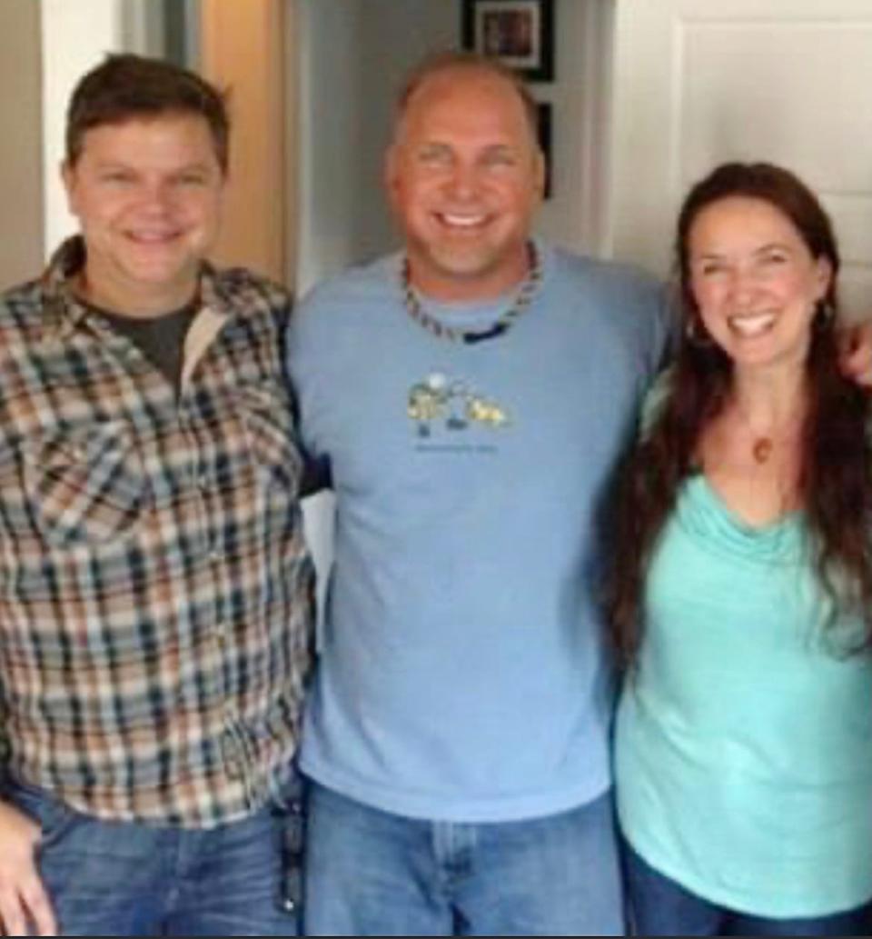Mark "Moke" Ivey is pictured with Garth Brooks and Kira Small.