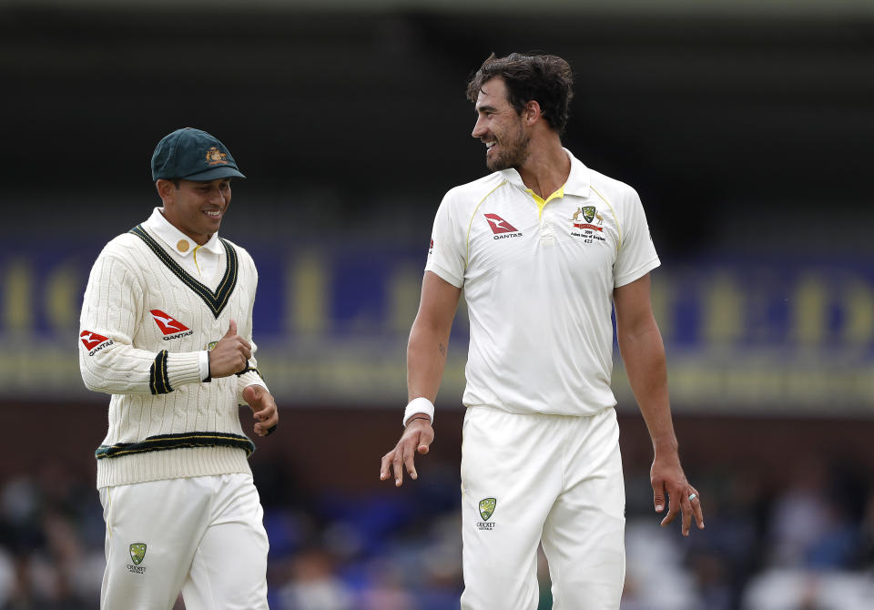 DERBY, ENGLAND - AUGUST 29: Mitchell Starc of Australia speaks to Usman Khawaja of Australia during day one of the Tour Match between Derbyshire CCC and Australia at The County Ground on August 29, 2019 in Derby, England. (Photo by Ryan Pierse/Getty Images)