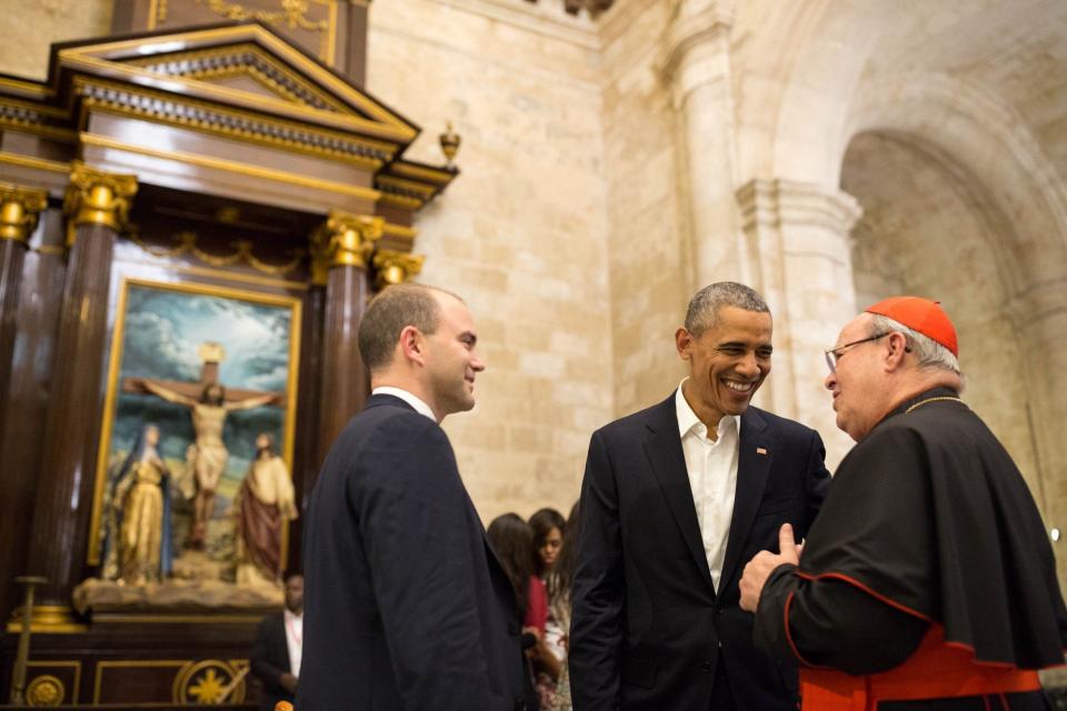 Obama and White House staffer Ben Rhodes talk with Cardinal Jamie Ortega while touring La Catedral de la Virgen Maria de la Concepcion Inmaculada in Old Havana.