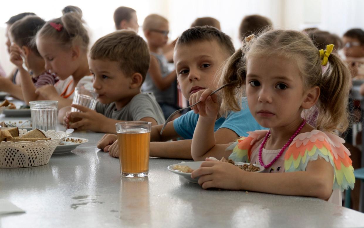 Children from an orphanage in the Donetsk region at a camp in Zolotaya Kosa, a settlement on the Sea of Azov in the Rostov region, of southwestern Russia - AP