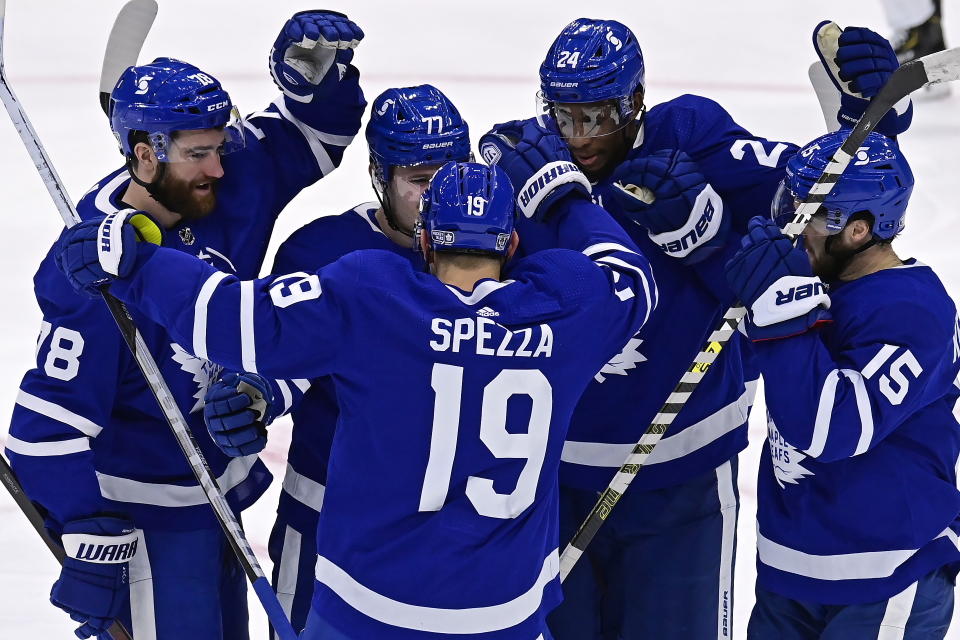 Toronto Maple Leafs' Adam Brooks (77) celebrates his goal against the Edmonton Oilers with teammates T.J. Brodie (78), Jason Spezza (19), Wayne Simmonds (24) and Alexander Kerfoot (15) during the second period of an NHL hockey game Friday, Jan. 22, 2021, in Toronto. (Frank Gunn/The Canadian Press via AP)