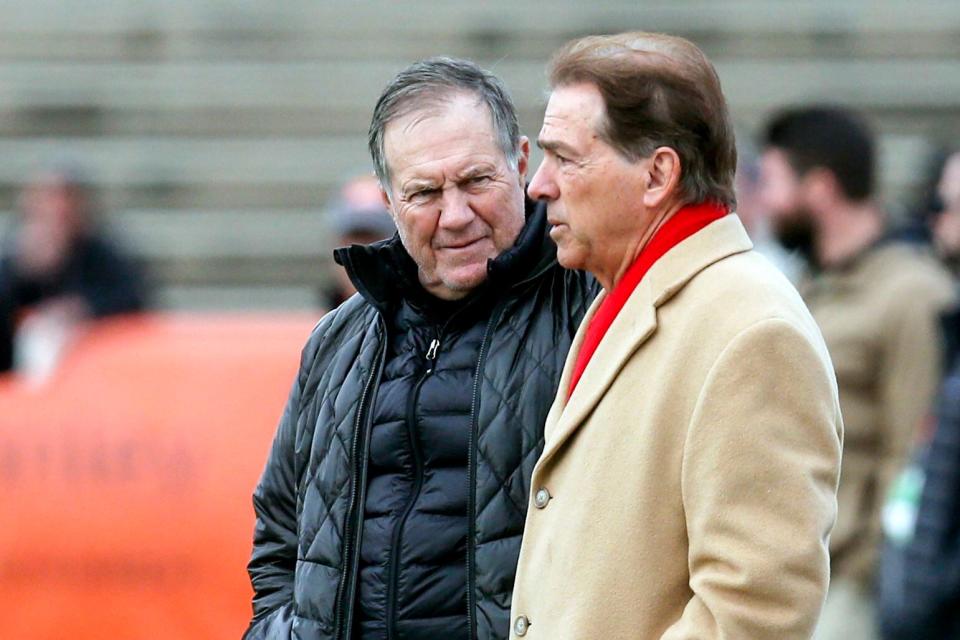 Bill Belichick and Nick Saban talk as the South squad runs drills during practice for the Senior Bowl Wednesday, Jan. 22, 2020, in Mobile, Ala. (AP Photo/Butch Dill)