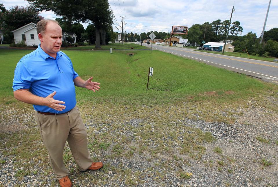 Neil Brock talks about the widening project scheduled for South New Hope Road between Titman and Union-New Hope roads. Brock purchased the property at 4702 S. New Hope as a second location for his Belmont based insurance business. His building plans are on hold until he finds out how much road frontage he may loose due to the road construction. [JOHN CLARK/THE GASTON GAZETTE]