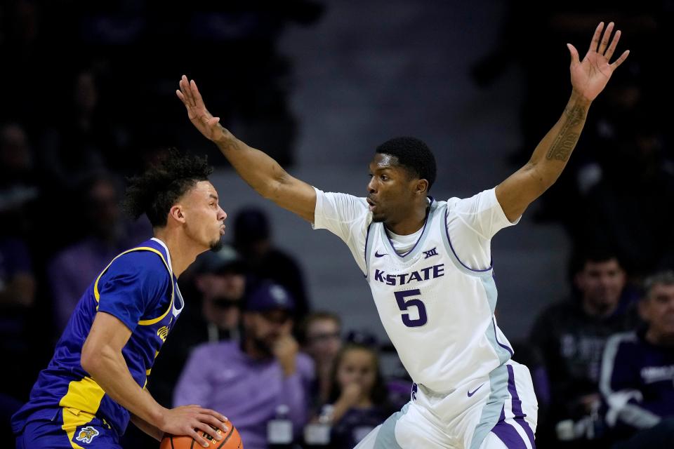 Kansas State guard Cam Carter (5) defends against South Dakota State guard Zeke Mayo, left, during a Nov. 13 game at Bramlage Coliseum in Manhattan. Carter and K-State will face Wichita State on Thursday night in Kansas City.