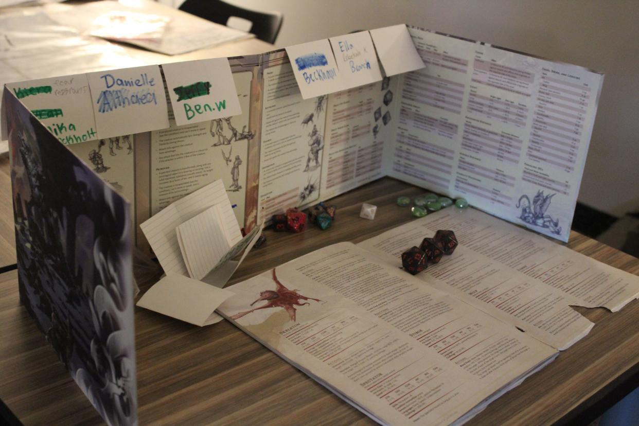 A dungeon master's station helps them lead the game of Dungeons & Dragons in Kade Wells' classroom at Harrisburg East Middle School.