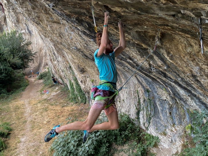 Loic Zehani cutting feet on shallow pockets on one of the hard lower sections of his new 5.15b, Quartier's Nord