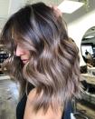 <p>This ash-brown hair color is all about <em>shine. </em>Hot tip: One of the easiest ways to keep your color looking fresh is to <strong>(A) load up on <a href="https://www.cosmopolitan.com/style-beauty/beauty/g26132600/heat-protection-hair-spray/" rel="nofollow noopener" target="_blank" data-ylk="slk:protectant;elm:context_link;itc:0;sec:content-canvas" class="link ">protectant</a> before heat styling and (B) avoid prolonged sun exposure</strong>, says Rubel.</p><p><a href="https://www.instagram.com/p/CCcSJX4haqI/" rel="nofollow noopener" target="_blank" data-ylk="slk:See the original post on Instagram;elm:context_link;itc:0;sec:content-canvas" class="link ">See the original post on Instagram</a></p>