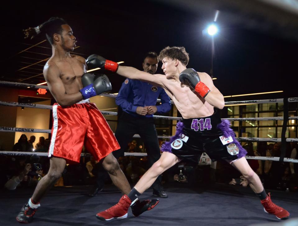 Javier Zamarron punches Sean Williams in a featherweight match (126 pounds) during a boxing program Saturday, January 14, 2023, at Gather in Milwaukee, Wisconsin.