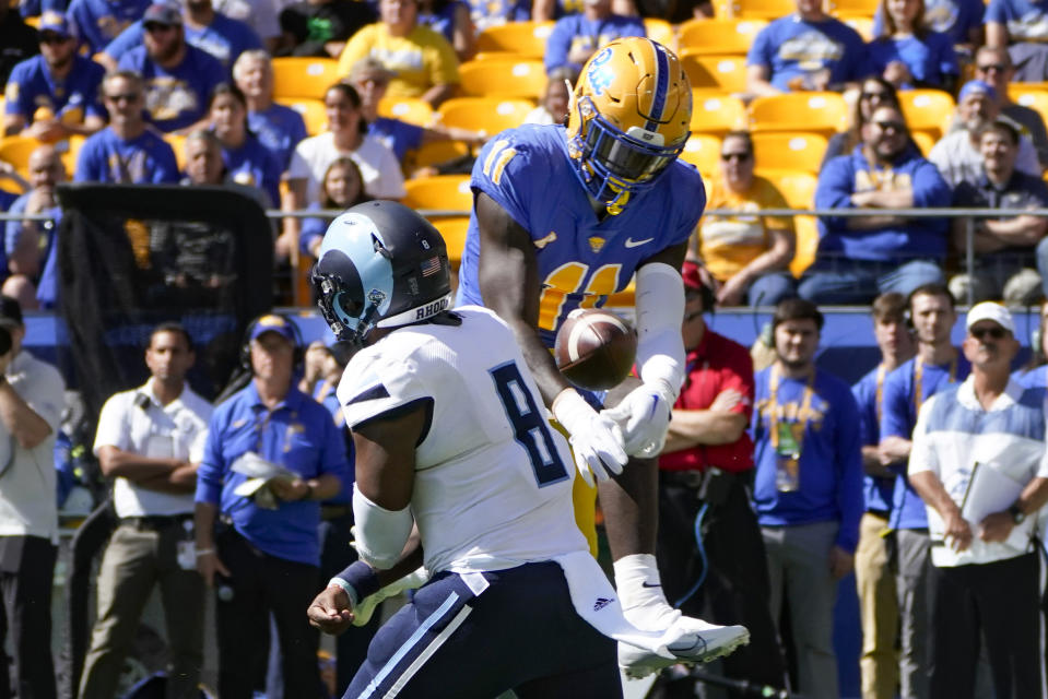 Pittsburgh linebacker Bangally Kamara (11) blocks a pass by Rhode Island quarterback Kasim Hill (8) during the first half of an NCAA college football game, Saturday, Sept. 24, 2022, in Pittsburgh. (AP Photo/Keith Srakocic)