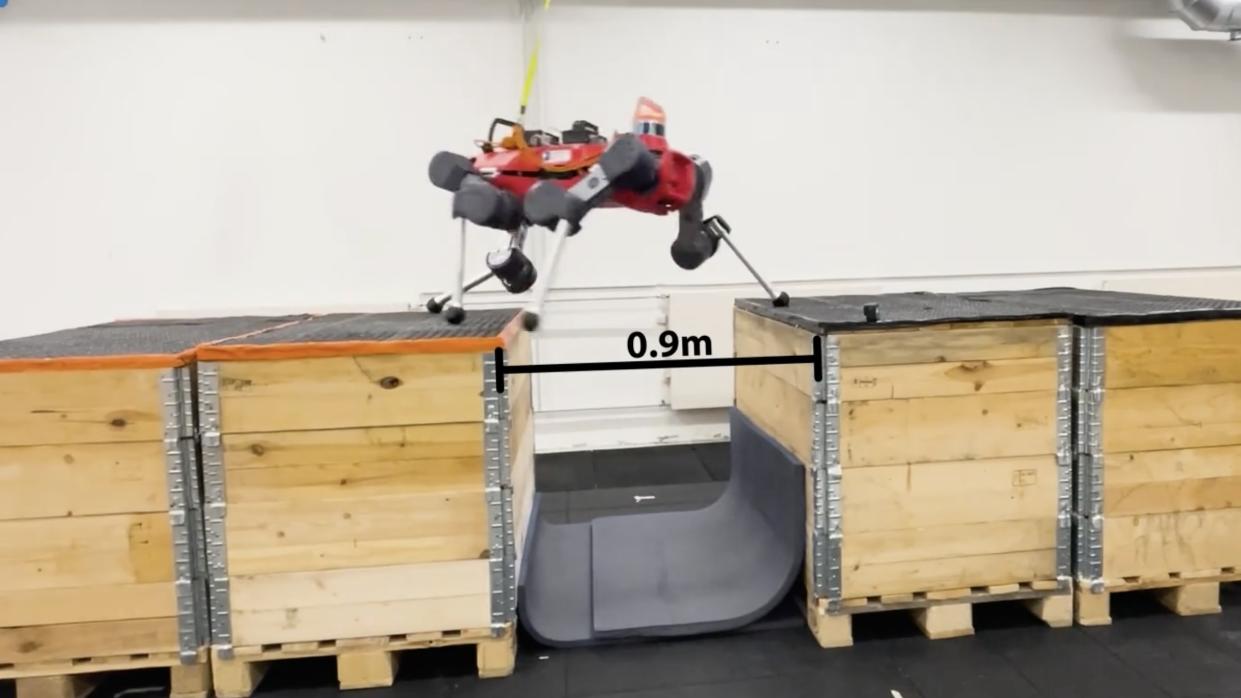  The four-legged dog-like robot jumping between boxes. 