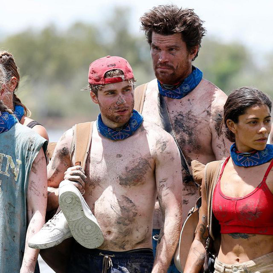 Survivor Australia 2022 contestants Alex Frost and Mark Wales shirtless and covered in mud. Photo: Channel 10.