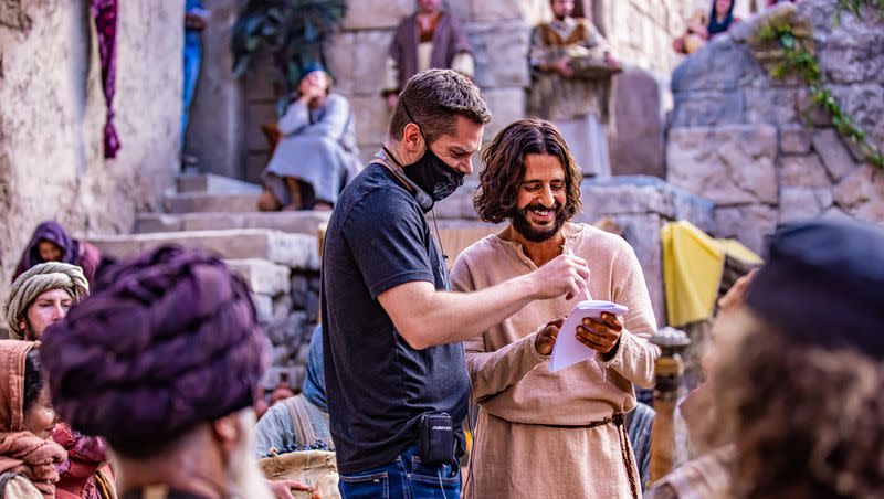 Director Dallas Jenkins, left, and actor Jonathan Roumie, who plays Jesus, talk while filming Season 2 of “The Chosen.”