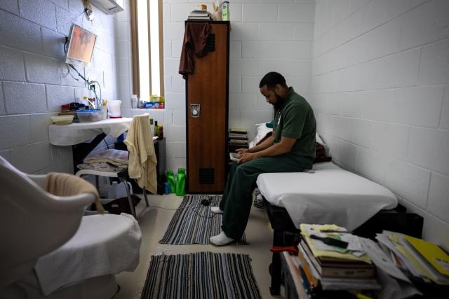 Inmate Joseph sits on the bed inside his cell in the &quot;Little Scandinavia&quot; unit.