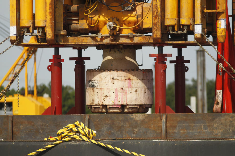 FILE - In a Sept. 13, 2010 file photo, the bottom of the blowout preventer stack, from the Deepwater Horizon explosion and oil spill, which is being examined as evidence for federal investigations, is seen at the NASA Michaud Assembly facility in New Orleans. The Biden administration has tightened offshore oil drilling safety regulations, including rules regarding the use of “blowout preventer” devices on offshore oil and gas drilling rigs. Planned changes announced last fall were finalized Tuesday, Aug. 22, 2023 — more than 13 years after the BP Deepwater Horizon disaster that killed 11 workers and spewed an estimated 130 million gallons of oil into the Gulf of Mexico. (AP Photo/Gerald Herbert, File)