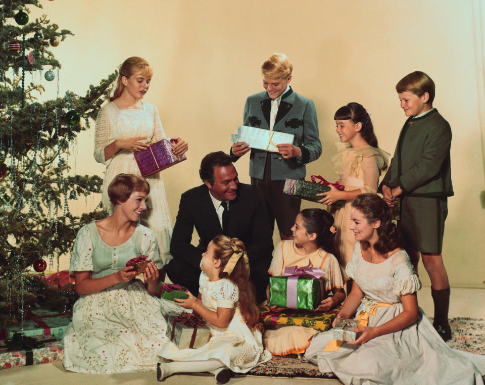 Julie Andrews (left) and Plummer (center, in suit) in "The Sound of Music." (Photo: Bettmann via Getty Images)