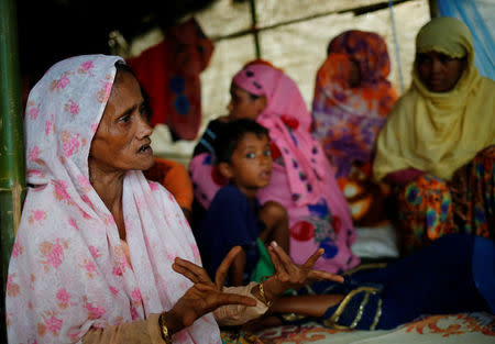 Shamsun Nahar (L), 60, a Rohingya widow who fled from Kha Maung Seik village of Myanmar to Bangladesh alone, who’s 30 year-old son is missing, tells her story at Kutupalang Makeshift Camp in Cox’s Bazar, Bangladesh, September 4, 2017. REUTERS/Mohammad Ponir Hossain