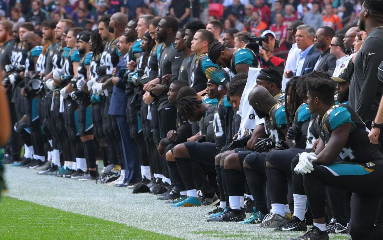 Jacksonville Jaguar NFL players kneeling - David Fisher/REX/Shutterstock