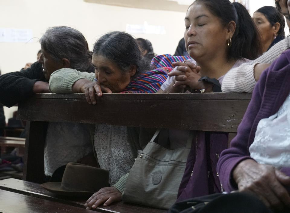People attend a funeral mass for Clemer Rojas, 23, who was killed during protests against new President Dina Boluarte, in Ayacucho, Peru, Saturday, Dec. 17, 2022. The eight deaths this week that converted Ayacucho into the epicenter of violence in Peru's still unfolding crisis is for many a stark reminder of the region's bloody past and longstanding neglect by authorities in the far-away capital. (AP Photo/Franklin Briceno)