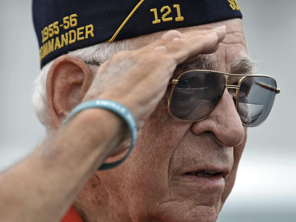 World War II Veteran Gene Gallagher, 91, of Clarks Summit, Pa., who served in the U.S. Army Air Corps, salutes the casket containing the remains of U.S. Army Pfc. paratrooper Willard "Bud" Jenkins of Scranton who was killed in action in 1944 during World War II on Wednesday, Sept. 27, 2018, in Scranton, Pa. ( Butch Comegys / The Scranton Times-Tribune via AP)