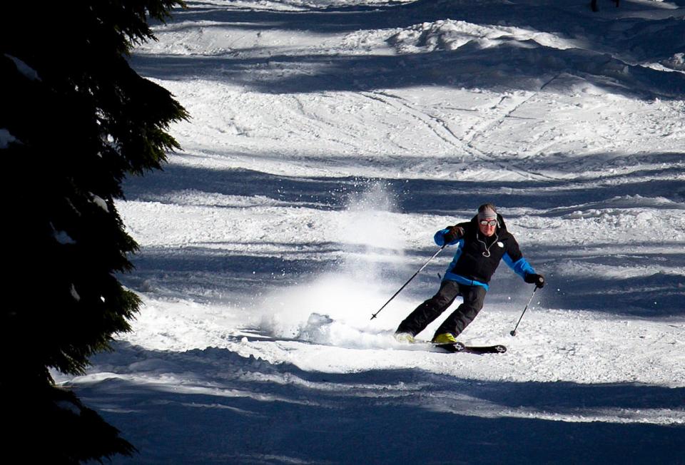 A skier rides down Rough Cut under the Twilight Lift at Willamette Pass Resort last December.