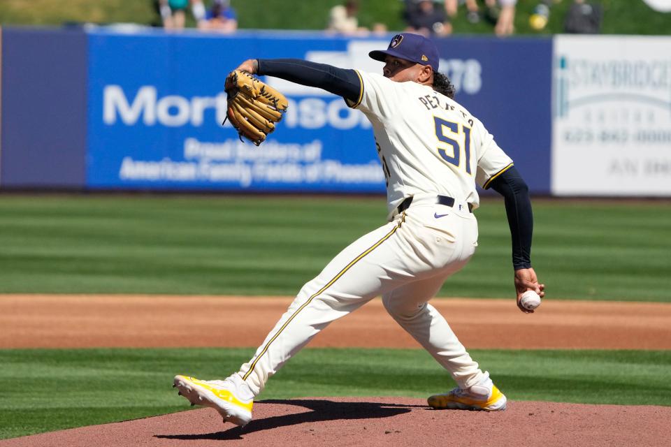 Mar 9, 2024; Phoenix, Arizona, USA; Milwaukee Brewers starting pitcher Freddy Peralta (51) throws against the Seattle Mariners in the first inning at American Family Fields of Phoenix. Mandatory Credit: Rick Scuteri-USA TODAY Sports