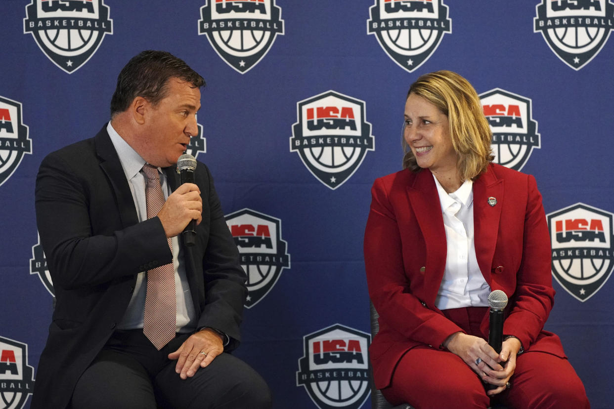 Minnesota Lynx head coach Cheryl Reeve smiles as she is introduced by USA Basketball CEO Jim Tooley during a press conference to announce she'd been named the head coach of women's USA Basketball, Wednesday, Dec. 8, 2021, at the Target Center in Minneapolis. (Anthony Souffle/Star Tribune via AP)