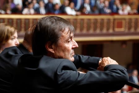 Nicolas Hulot, French Minister for the Ecological and Inclusive Transition, listens to the speech of French President Emmanuel Macron during a special congress gathering both the upper and lower houses of the French parliament (National Assembly and Senate) in Versailles near Paris, France, July 9, 2018. REUTERS/Charles Platiau