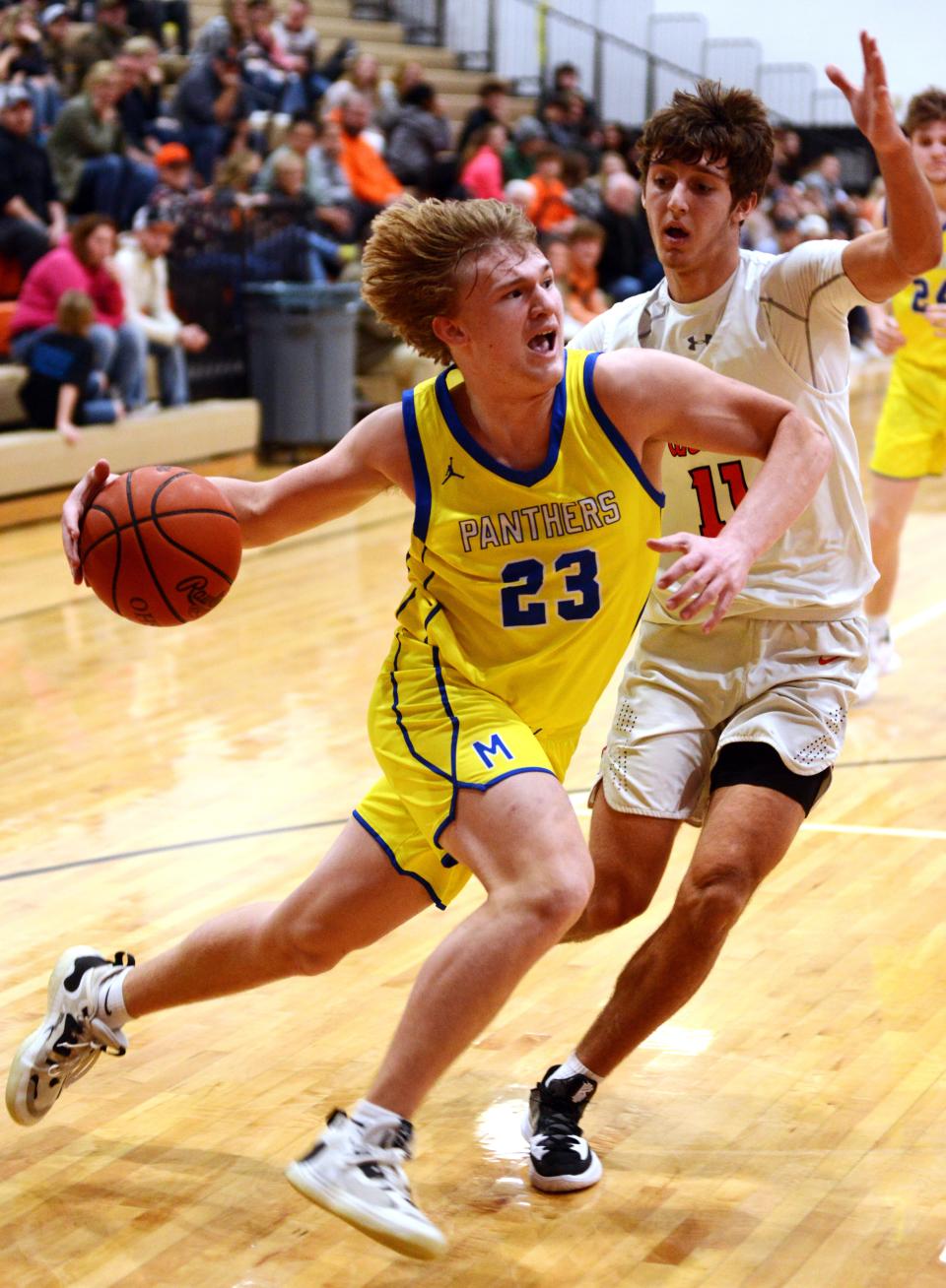 Hayden Jarrett drives to the basket on Lukas Ratliff during Maysville's win against host New Lexington last season. Jarrett and Alex Bobb have the Panthers entering this season with high expectations.