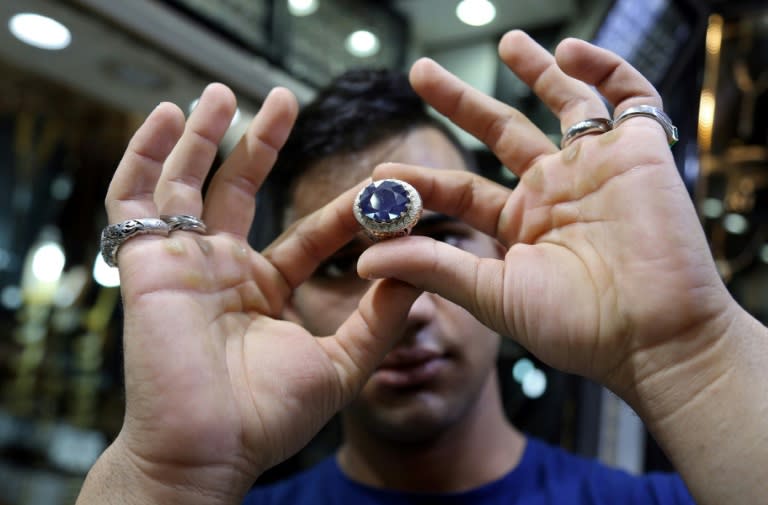 For many pilgrims visiting the Iraqi Shiite holy city of Najaf, buying a gemstone ring is part and parcel of the experience