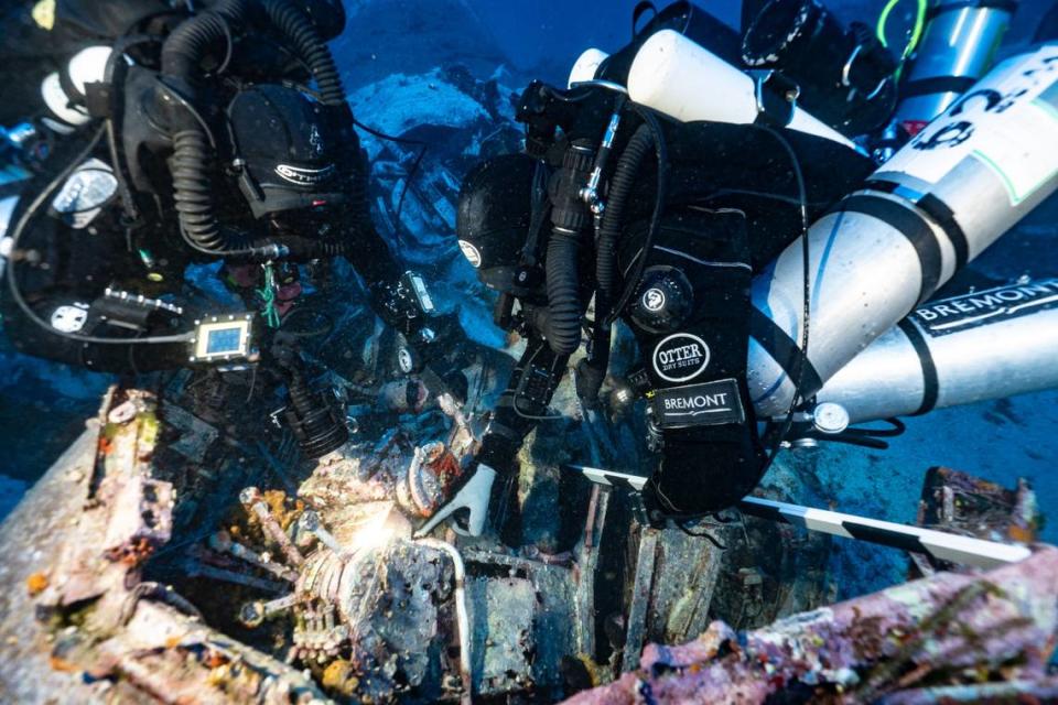 Divers work on the B-24 Liberator wreck during excavations in 2018 to 2019.