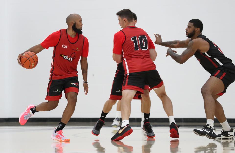 Former Bellarmine basketball player Chris Dowe dribbles during The Ville's practice at the Kueber Center in Louisville, Ky. on July 18, 2023.