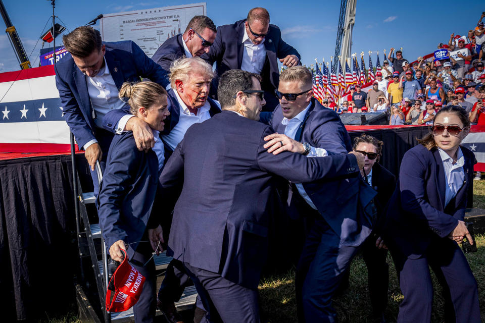 US Secret Service agents remove Donald Trump from the stage.  (Jabin Botsford/The Washington Post via Getty Images)