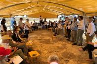 NGO workers speak to EU heads of mission and other local envoys during a diplomatic tour of Palestinian villages, near al-Mughayyir in the Israeli-occupied West Bank