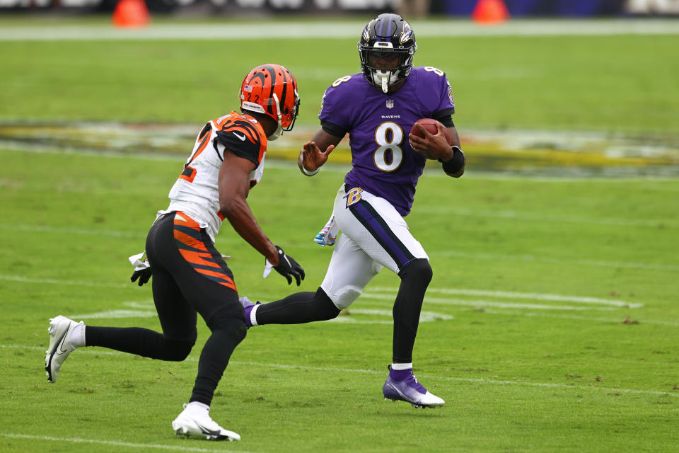 BALTIMORE, MARYLAND - OCTOBER 11: Lamar Jackson #8 of the Baltimore Ravens runs with the ball during the first half against the Cincinnati Bengals at M&T Bank Stadium on October 11, 2020 in Baltimore, Maryland. (Photo by Todd Olszewski/Getty Images)