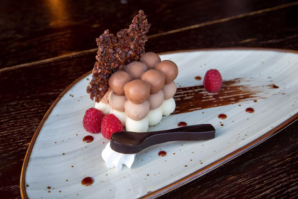 "Aphrodisiac," a dessert of dark, milk and white chocolate mascarpone mousses, espresso rice sponge, cocoa nib nougatine, raspberry pomegranate molasses and coffee glaze, at The Loaded Spoon in Freehold Township.