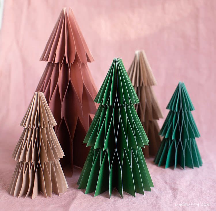 <p>If you love paper honeycomb decorations, this DIY by <a href="https://go.redirectingat.com?id=74968X1596630&url=https%3A%2F%2Fliagriffith.com%2Ffrosted-paper-honeycomb-trees%2F&sref=https%3A%2F%2Fwww.housebeautiful.com%2Fentertaining%2Fholidays-celebrations%2Fg22675518%2Feasy-christmas-craft-ideas%2F" rel="nofollow noopener" target="_blank" data-ylk="slk:Lia Griffith;elm:context_link;itc:0;sec:content-canvas" class="link ">Lia Griffith</a> is a must-try craft. Surround them with fairy lights for a glowing display, and spray paint them a little white paint at the top for a frosted look.</p>