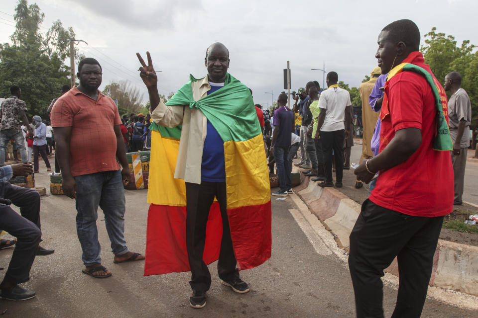 Anti-government protesters demonstrate in the capital Bamako, Mali Friday, July 10, 2020. Thousands marched Friday in Mali's capital in anti-government demonstrations urged by an opposition group that rejects the president's promises of reforms. (AP Photo/Baba Ahmed)