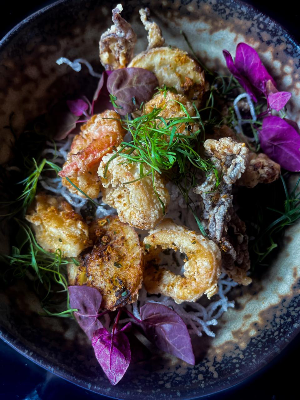 Muc chien gion, a crispy salt and pepper calamari with jalapeño, lemon and tamarind sauce, is just one of the delicious specials available on Mother's Day at Le Colonial in Delray Beach.