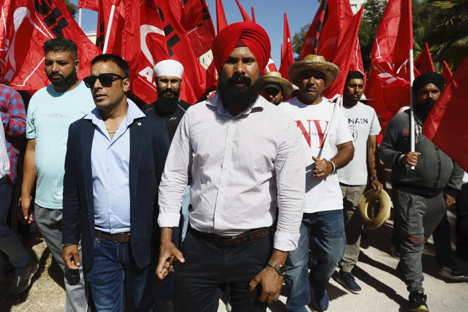 Members of the Indian community in Italy protest in Latina, some 60 kilometers south of Rome, Saturday, June 22, 2024, asking justice for Satnam Singh, an Indian laborer, bled to death after his arm got stuck in a nylon-wrapping machine and was wrenched off. Police on Tuesday arrested Antonello Lovato, a farm owner on suspicion of homicide after he allegedly refused entreaties by Singh's wife, who also worked at the farm, to call an ambulance, claiming he was already dead. (Cecilia Fabiano/LaPresse via AP)