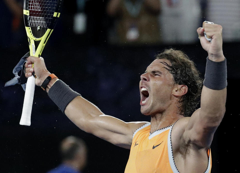 Spain's Rafael Nadal celebrates after defeating Greece's Stefanos Tsitsipas in their semifinal at the Australian Open tennis championships in Melbourne, Australia, Thursday, Jan. 24, 2019. (AP Photo/Aaron Favila)