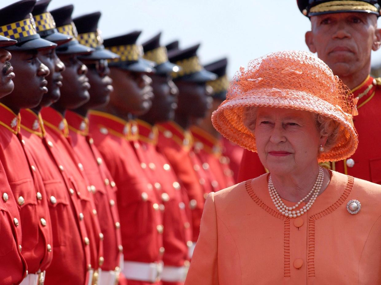 Queen Elizabeth II Beginning Her Jubilee Tour In This Commonwealth Country Just Three Days After The Funeral Of Her Younger Sister. Changing From Her Black Mourning Clothes She Chose A Bright Orange Colour To Celebrate This Important First Overseas Visit Of Her Jubilee Year. She Is Inspecting A Guard Of Honour Of The Jamaica Defence Force. (