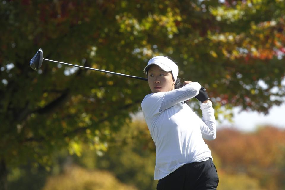 Columbus School for Girls' Emma Kim tees off during the Division II state tournament Oct. 15.