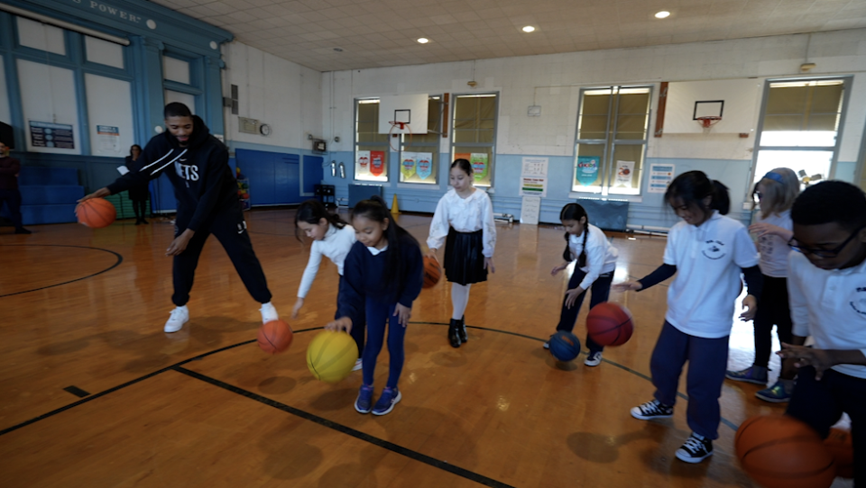 Mikal Bridges in gym class with fourth graders at PS 134.  / Credit: CBS News