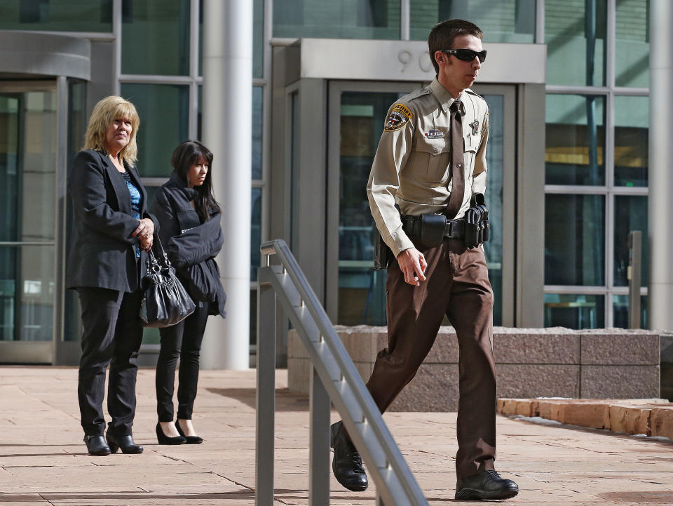 Texas Deputy James Boyd walks from court during a break in a sentencing hearing for a woman who pleaded guilty to buying the handgun used to kill Nathan Leon and the director of Colorado Prisons, at the Federal Courthouse, in Denver, Monday March 3, 2014. Stevie Marie Anne Vigil was sentenced to more than two years in prison and three years supervision for buying the handgun for Evan Ebel, a parolee and member of a white supremacist prison gang. Boyd, who was shot by Ebel, spoke during the hearing. (AP Photo/Brennan Linsley)