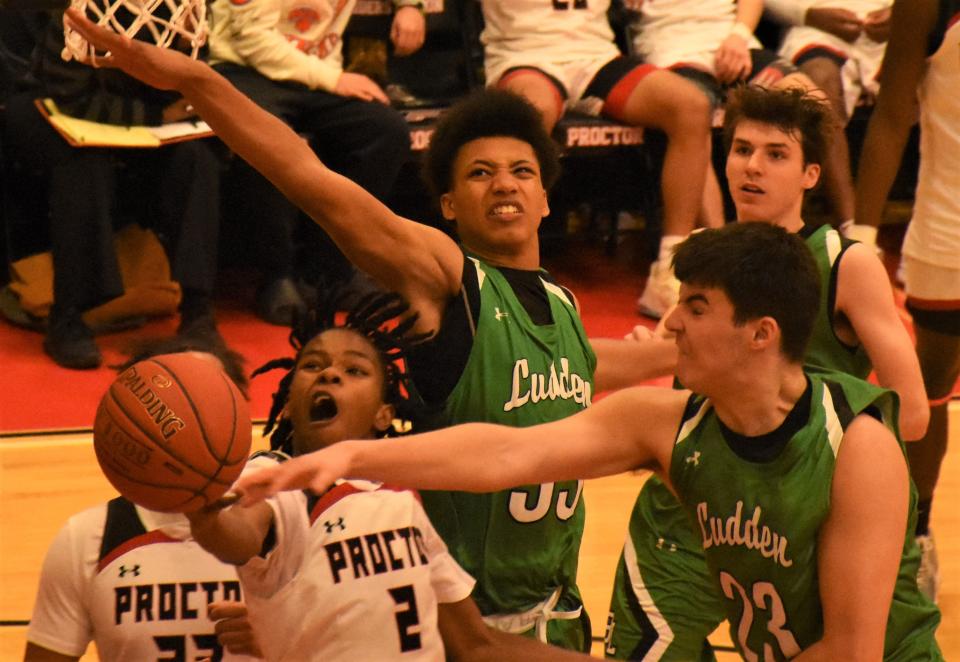 Proctor senior Marc Simmons shoots amid a trio of Bishop Ludden defenders during the fourth quarter of Saturday's Section III quarterfinal.