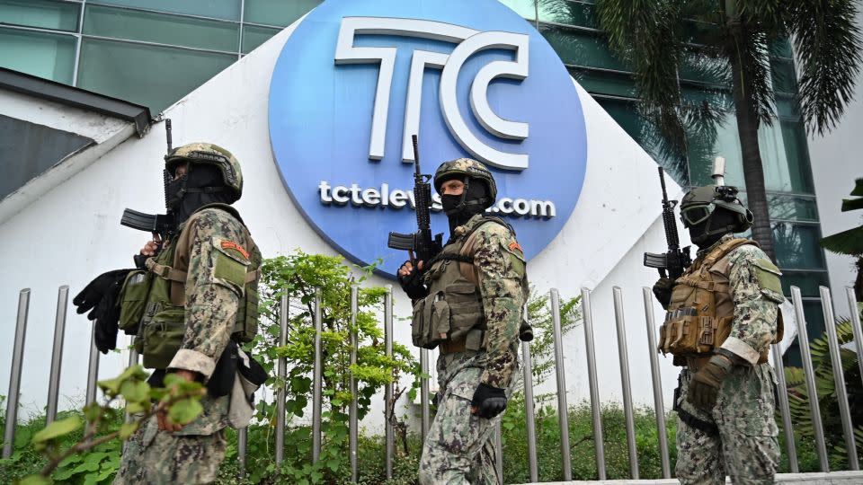 Soldiers patrol outside the premises of Ecuador's TC television channel after gunmen stormed the studio live on air, January 9, 2023. - Marcos Pin/AFP/Getty Images