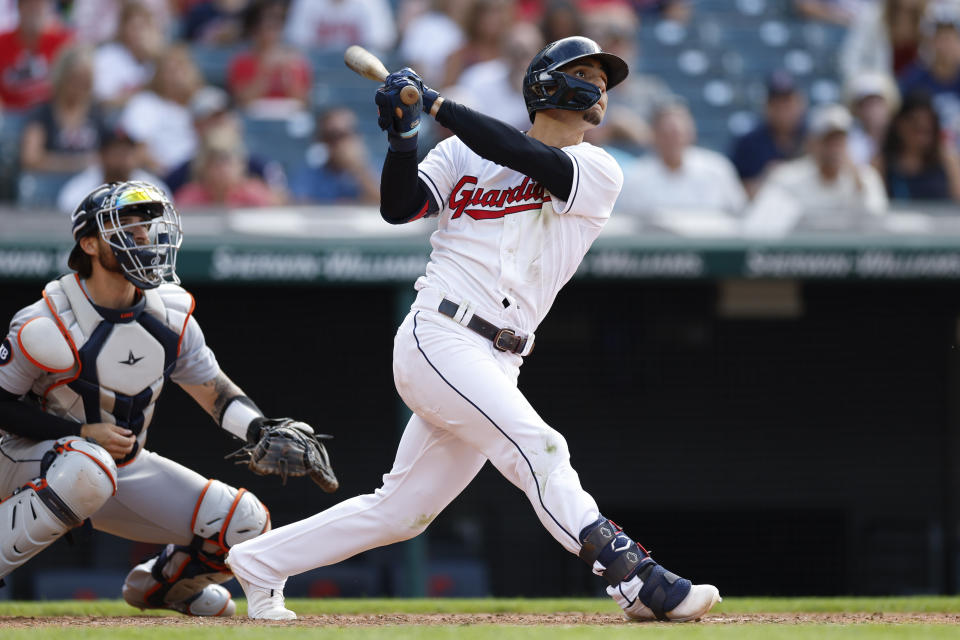 Cleveland Guardians' Andres Gimenez watches his three-run home run off Detroit Tigers relief pitcher Andrew Chafin, next to catcher Eric Haase during the seventh inning in the first baseball game of a doubleheader Monday, Aug. 15, 2022, in Cleveland. (AP Photo/Ron Schwane)